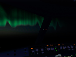 The northern lights framed in the window of the A320