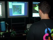 Playing KReversi with a red laser pointer at OSWC 2008