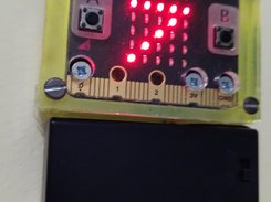 Cycleball timer, shown as a micro:bit in a case with battery, speaker and clip