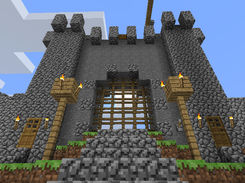 A town gate with functioning portcullis by PorteCoulissante.