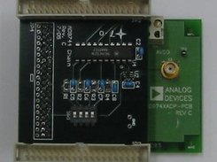 An AD9744 DAC eval. board and its chain daughterboard.