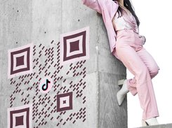 QRcodeLab - Fashion woman near 3D QR Code image on concrete wall