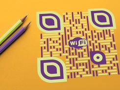 QRcodeLab - custom QR code with 3D effect near color pencils on a table